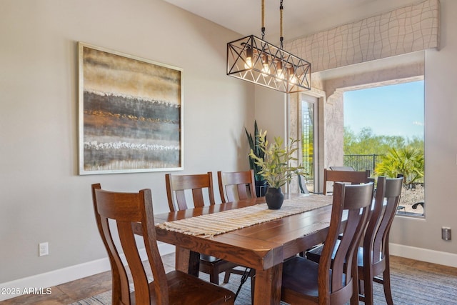 dining room featuring baseboards