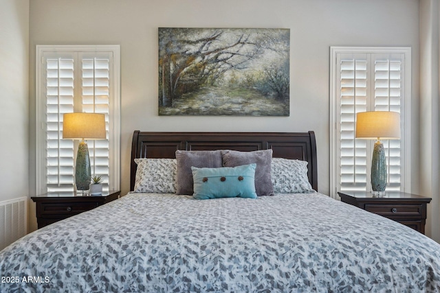 bedroom featuring visible vents
