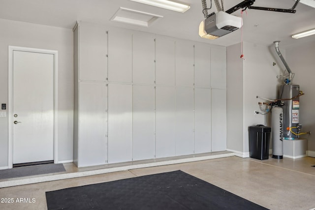 garage featuring water heater, baseboards, and a garage door opener