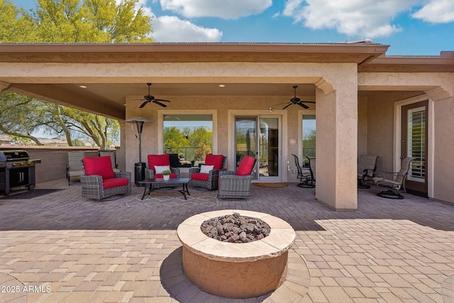 view of patio / terrace with a grill and an outdoor fire pit