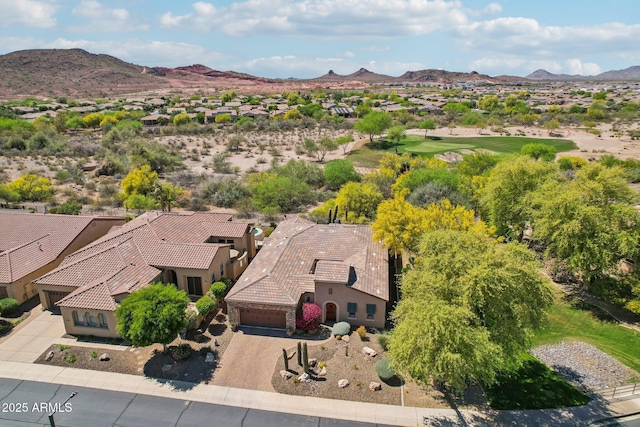 birds eye view of property with a mountain view and a residential view