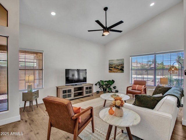 12641 S 39th Pl, Phoenix, AZ 85044 - living room with healthy amount of natural light, wood finished floors, a ceiling fan, recessed lighting, and high vaulted ceiling