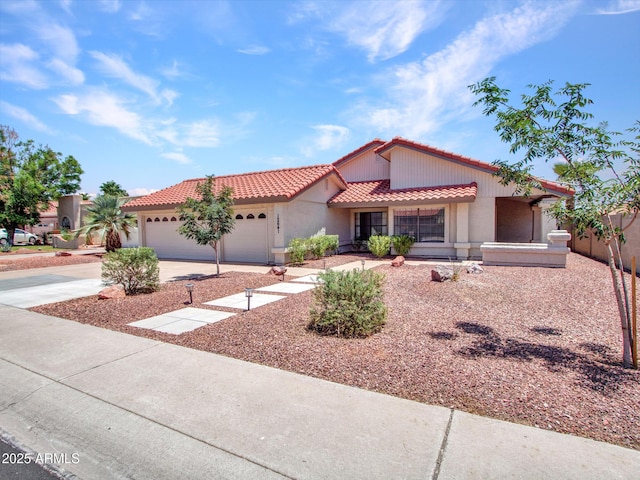 12641 S 39th Pl, Phoenix, AZ 85044 - mediterranean / spanish-style house with a tiled roof, concrete driveway, an attached garage, and stucco siding