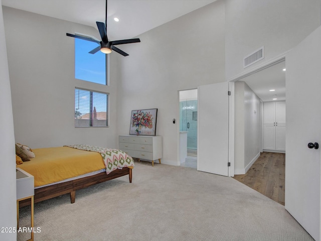 12641 S 39th Pl, Phoenix, AZ 85044 - carpeted bedroom with a towering ceiling, recessed lighting, connected bathroom, and a ceiling fan