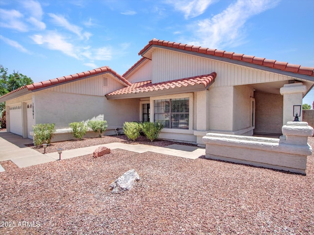 12641 S 39th Pl, Phoenix, AZ 85044 - view of front of house featuring a tiled roof, a garage, and stucco siding
