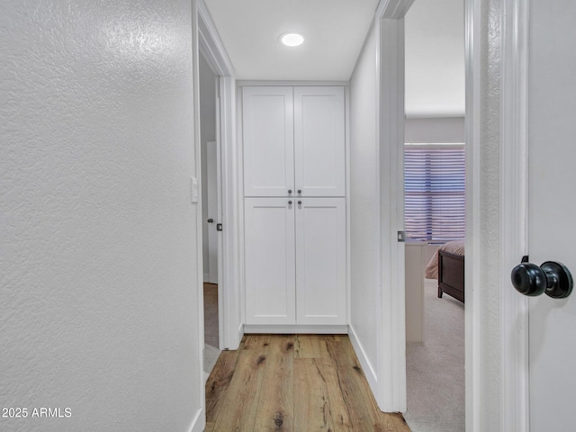 12641 S 39th Pl, Phoenix, AZ 85044 - hall with a textured wall and light wood-style flooring