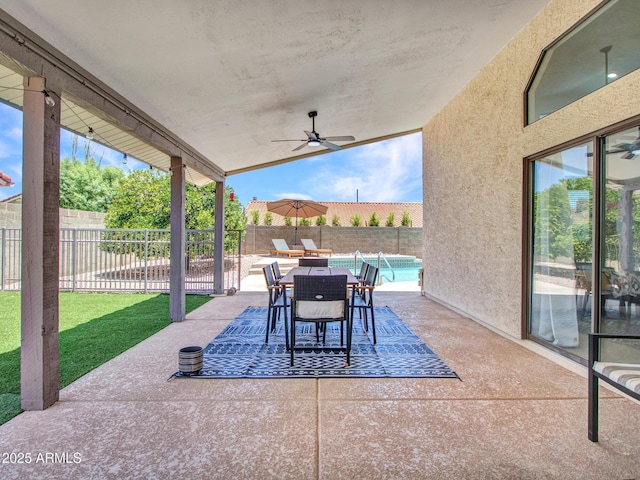 12641 S 39th Pl, Phoenix, AZ 85044 - fenced backyard featuring a patio, outdoor dining space, and a ceiling fan