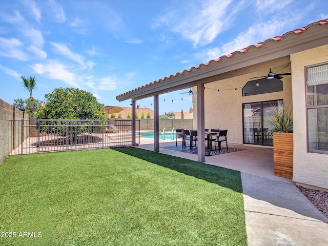 12641 S 39th Pl, Phoenix, AZ 85044 - fenced backyard with ceiling fan and a patio