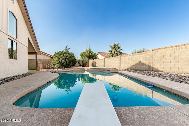 12641 S 39th Pl, Phoenix, AZ 85044 - view of pool with a fenced backyard, a diving board, and a patio