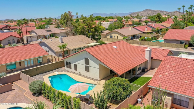 12641 S 39th Pl, Phoenix, AZ 85044 - view of swimming pool featuring a residential view, a mountain view, and a fenced backyard