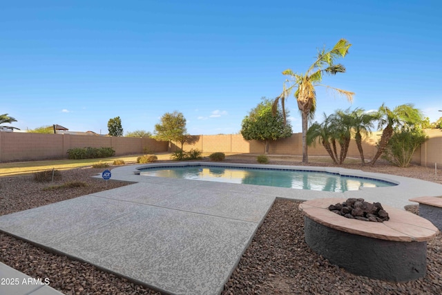 view of swimming pool featuring a fenced in pool, a patio, and a fenced backyard