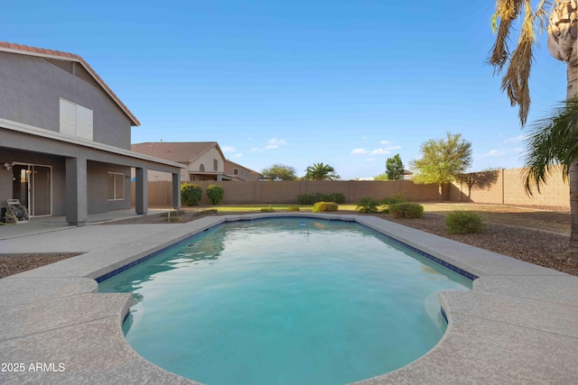 view of swimming pool with a patio area, a fenced in pool, and a fenced backyard