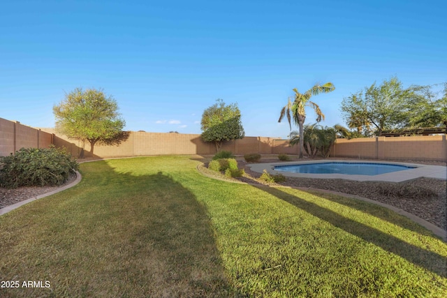 view of yard featuring a fenced in pool and a fenced backyard