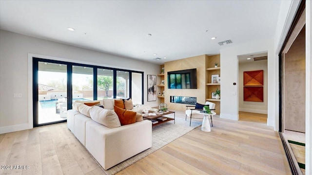 living room with light hardwood / wood-style floors