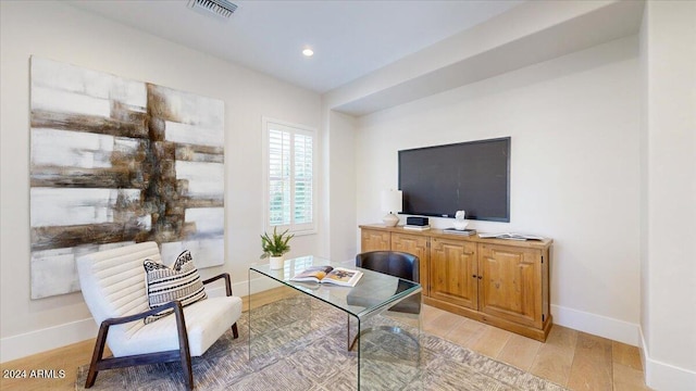 sitting room with light hardwood / wood-style floors