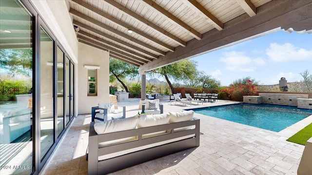 view of swimming pool featuring a patio and an outdoor hangout area