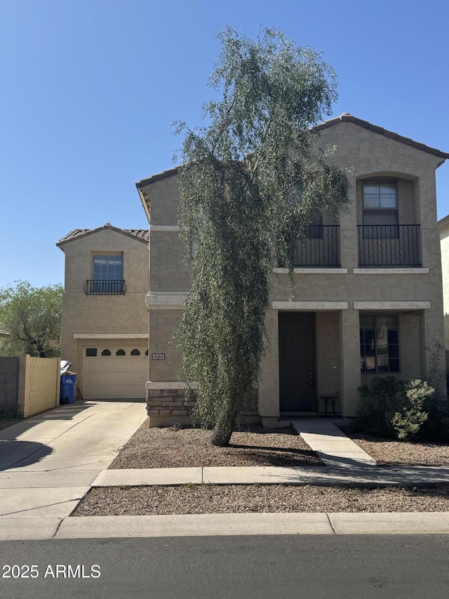3661 E Stampede Dr, Gilbert, AZ 85297 - view of front facade with stucco siding, a balcony, driveway, a garage, and a tiled roof