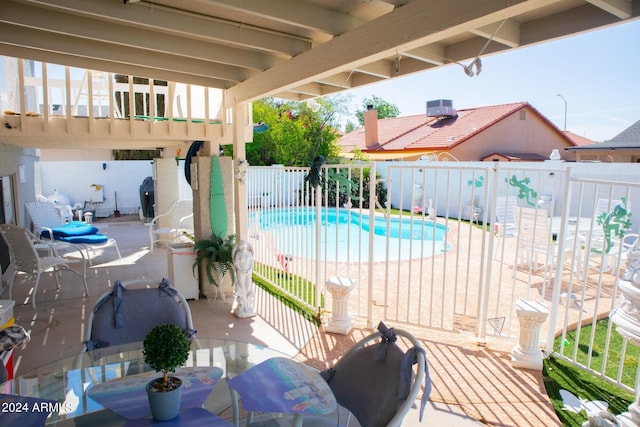 view of swimming pool featuring a patio area