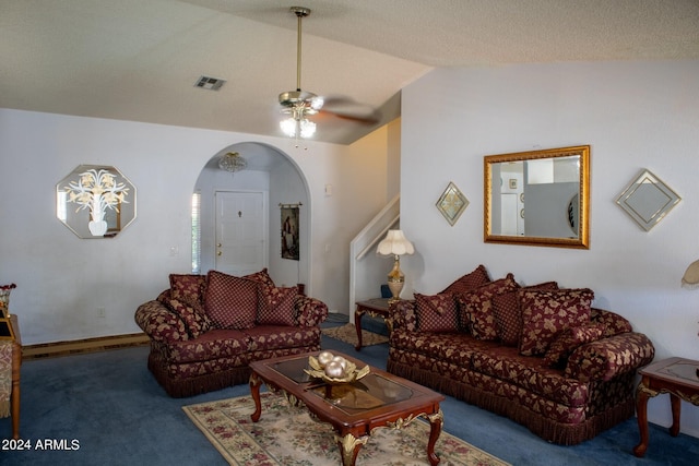 carpeted living room with vaulted ceiling and ceiling fan