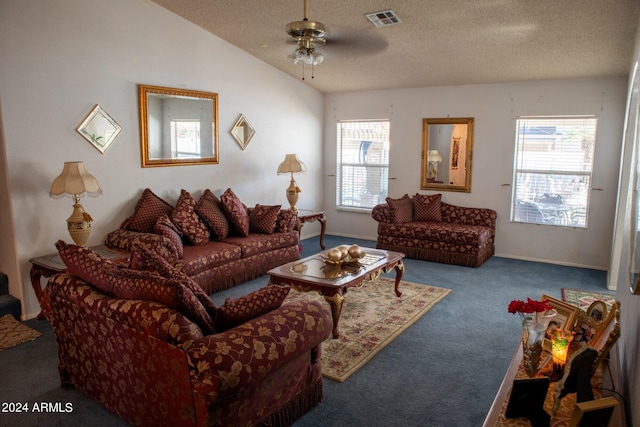 carpeted living room with a textured ceiling, ceiling fan, and lofted ceiling