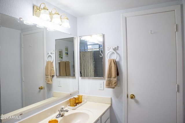 bathroom featuring vanity and walk in shower