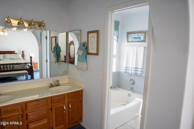 bathroom with vanity, tile patterned floors, and a bathing tub