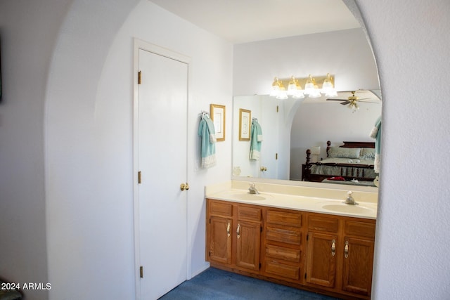 bathroom featuring ceiling fan and vanity