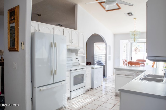 kitchen with sink, white cabinets, pendant lighting, white appliances, and light tile patterned floors