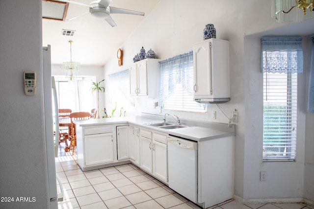 kitchen with dishwasher, white cabinetry, plenty of natural light, and lofted ceiling