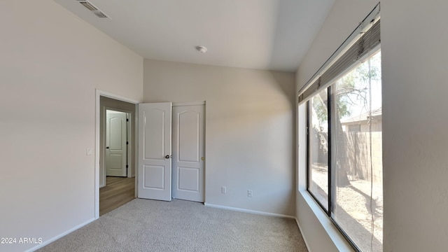 interior space featuring vaulted ceiling