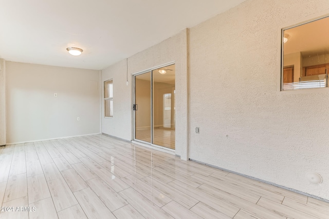 unfurnished room featuring light hardwood / wood-style flooring