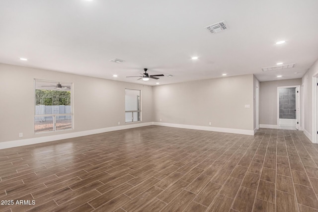 unfurnished living room with ceiling fan