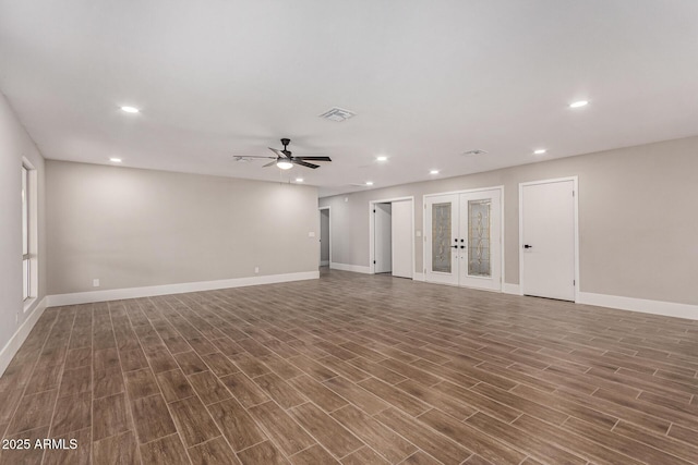 unfurnished living room featuring french doors and ceiling fan