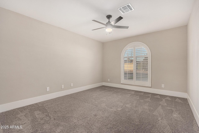 unfurnished room featuring ceiling fan and carpet