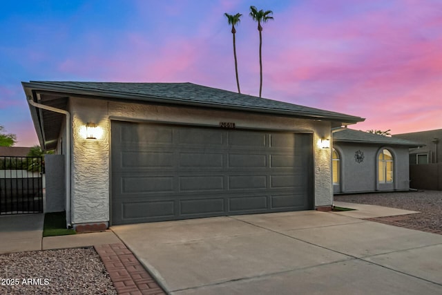 ranch-style home featuring a garage