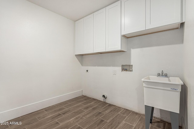 laundry area with washer hookup, sink, cabinets, and hookup for an electric dryer