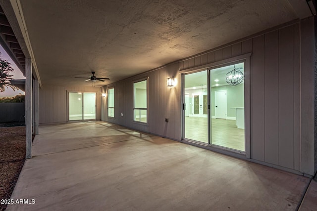 interior space with ceiling fan and french doors