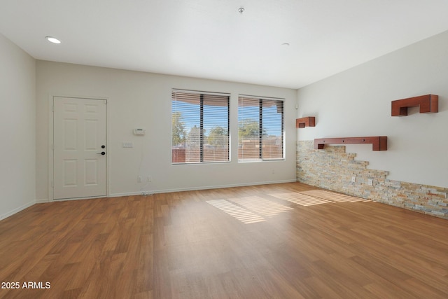 unfurnished living room featuring light hardwood / wood-style flooring