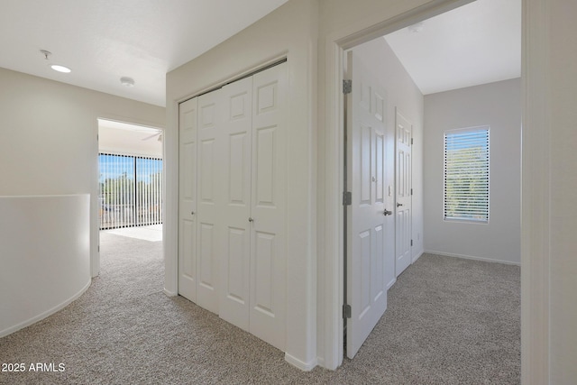 corridor with light colored carpet