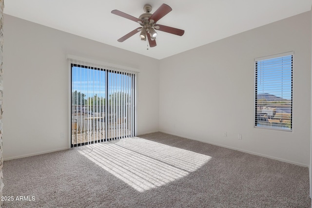 unfurnished room featuring carpet floors, ceiling fan, and a healthy amount of sunlight