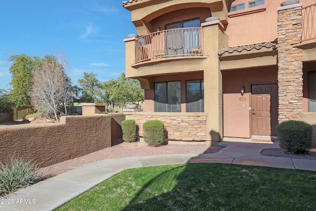 entrance to property featuring a balcony