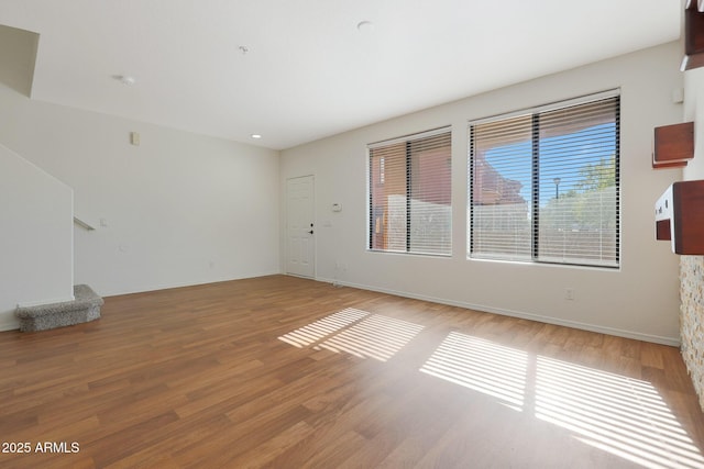 unfurnished living room with light hardwood / wood-style floors