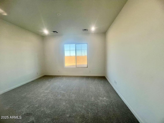 spare room with visible vents, baseboards, and carpet floors