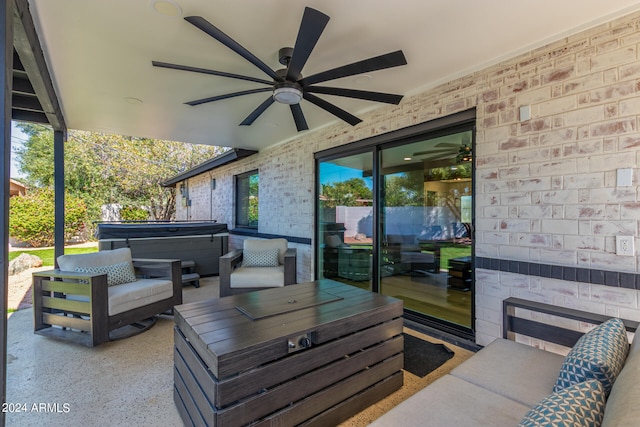 view of patio / terrace featuring a hot tub and ceiling fan