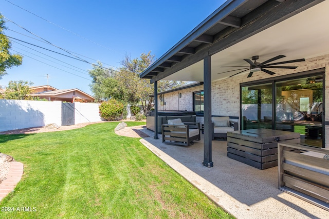 view of yard with a patio and ceiling fan