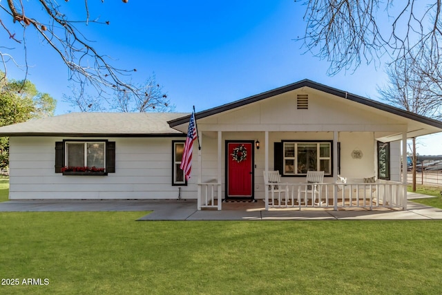 view of front of home with a porch and a front yard