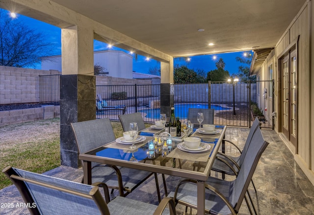 view of patio with outdoor dining area and a fenced backyard