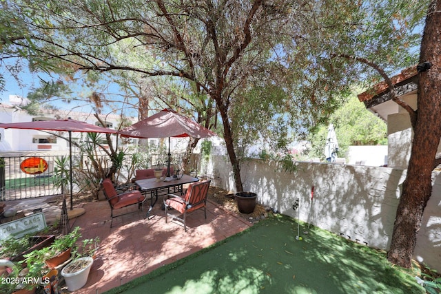 view of patio / terrace featuring a putting green