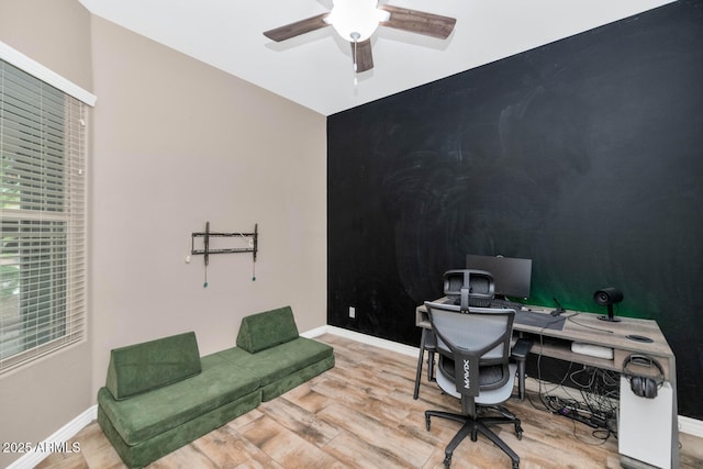 2605 W Desert Marigold Dr, Phoenix, AZ 85085 - office area featuring wood finished floors, ceiling fan, and baseboards