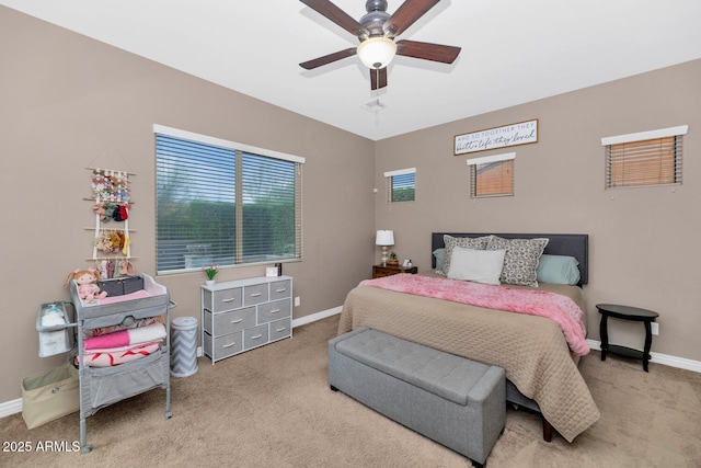 2605 W Desert Marigold Dr, Phoenix, AZ 85085 - bedroom with baseboards, a ceiling fan, and carpet floors